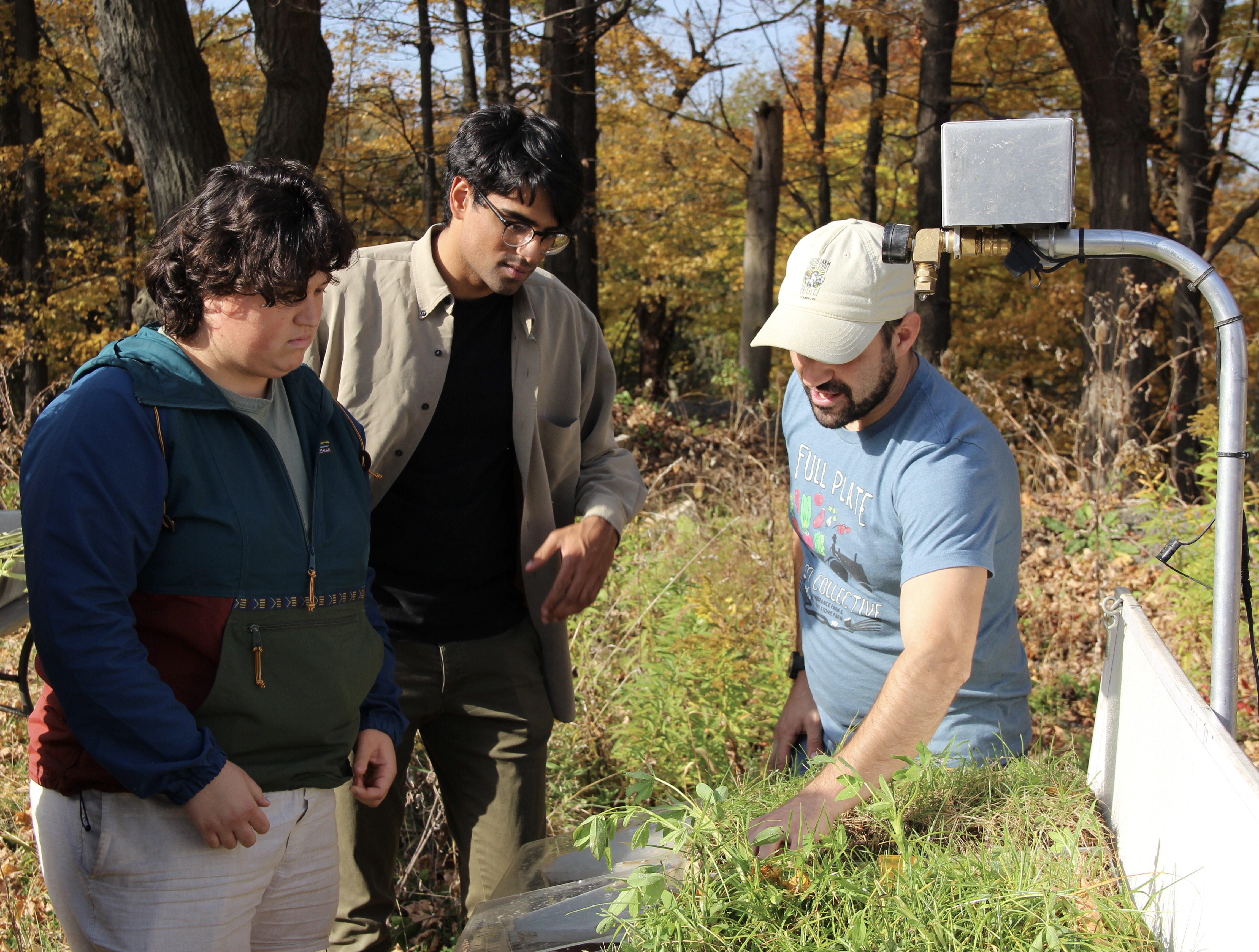 Dr. Joe demonstrates how crops impact soil water infiltration